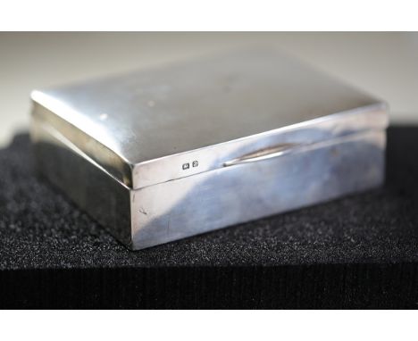 Vintage Silver Rectangular BoxA silver rectangular box with a hinged domed lid and rounded edges. The exterior has a polished