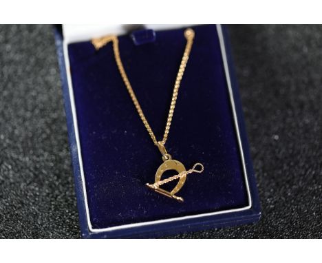 **Gold-Tone Horseshoe Necklace with Presentation Box - 3.14g 9CT**  The necklace features a fine gold-tone chain, likely meta