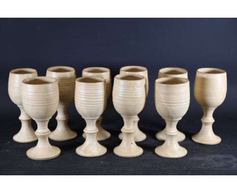 Set of Ten Handmade Ceramic Goblets  A set of ten handmade ceramic goblets characterised by a natural beige finish and a mini