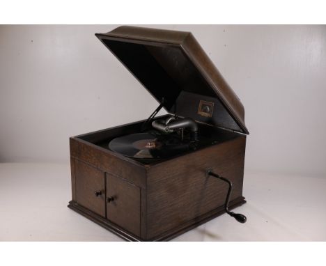 **Early 20th-Century HMV Gramophone with Accessories - Working Condition**This is an early-to-mid 20th-century tabletop HMV (