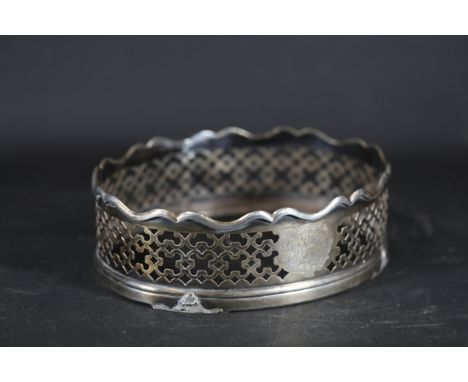**Georgian or Early Victorian Silver Pierced Bottle Coaster**  A pierced silver bottle coaster, acid-tested as silver, weighi