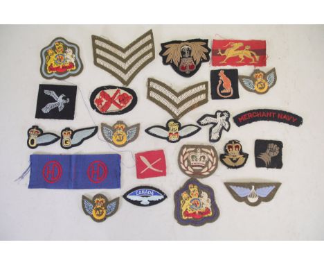 Collection of British and Commonwealth Military and Merchant Navy Insignias  A diverse collection of military and naval badge