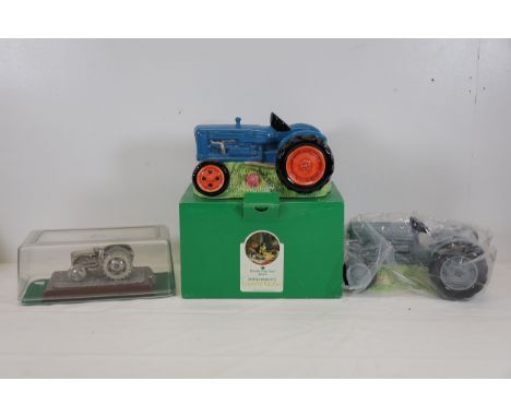Collection of Tractor-Themed Ornaments Featuring Money Boxes and Pewter FigurineThis collection includes two blue tractor mon