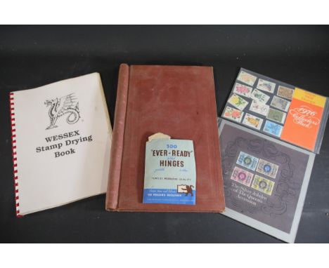 Stamp Collecting Materials and Commemorative Stamps Collection  A collection of philatelic items, including tools, albums, an