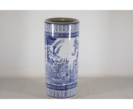 **20th-Century Chinese-Inspired Porcelain Umbrella Stand**A cylindrical porcelain umbrella stand, dating to the 20th century,