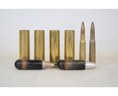 Six Assorted Ammunition Casings and Projectiles, Including Large-Caliber Brass Casings and Various Rifle CartridgesThis colle