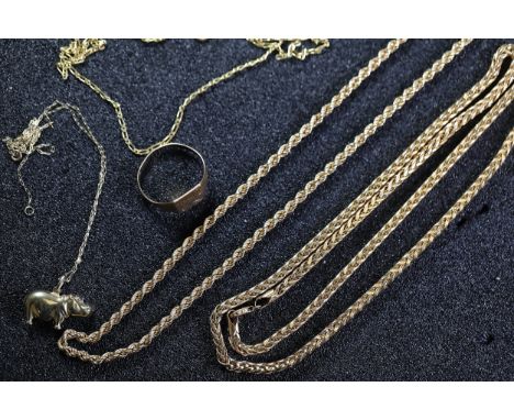 ### Collection of 9KT Gold Jewellery  Comprising a rope-style gold chain, a gold chain with a hippopotamus pendant, a plain g