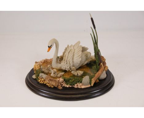 Countryside artists CA 714 First outing Swan and cygnets ornamentA detailed decorative figurine set featuring a white adult s