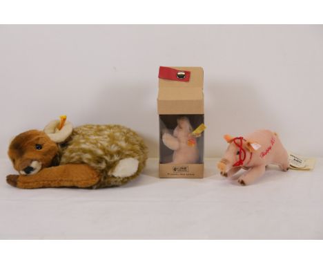 Steiff Collectible Plush Tri  2 pigs and baby deerA collection of three Steiff plush toys: a reclining baby deer with mottled