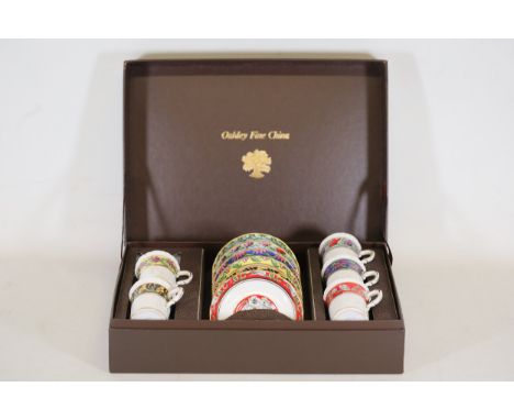 Oakley Fine China Harlequin Cups and Saucers Set in Display CaseThis charming collection of Oakley Fine China Harlequin cups 