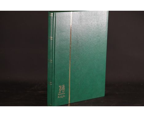 **Wessex Knight Green Stamp Album with Global Vintage Stamp Collection**  This item includes a "Wessex Knight" stamp album fe