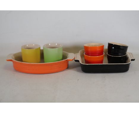 Vintage Le Creuset Cookware Collection with Casserole Dishes, Cups, and RamekinsThis vintage Le Creuset collection comprises 