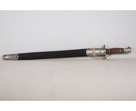1907 Lee-Enfield Bayonet with Leather ScabbardThis 1907 Lee-Enfield bayonet, measuring 22.5 inches in total length within its