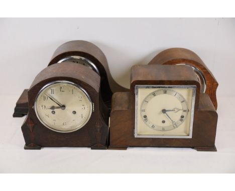 Four Vintage Mantel Clocks with Wooden Cases by various makers This collection comprises four vintage mantel clocks, each fea