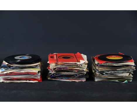 Vintage 7-Inch Vinyl Record Collection (1950s–1980s)This collection comprises three stacks of vintage 7-inch vinyl records, w