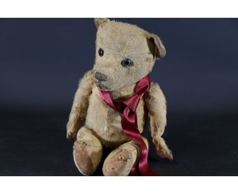 Vintage Early 20th-Century Teddy Bear  This is a vintage teddy bear, likely dating from the 1910s to the 1930s, made from moh