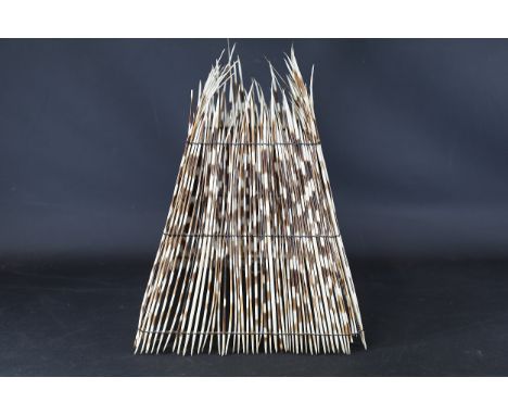 Porcupine Quill Decorative Lampshade  A handcrafted conical lampshade constructed from natural porcupine quills, arranged ver
