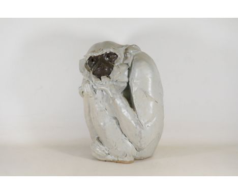 Contemplative Gibbon Monkey Ceramic Sculpture by Peter VostThis exquisite ceramic sculpture captures a gibbon monkey in a pro