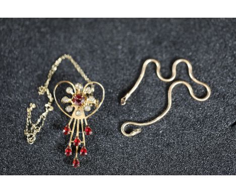 Gold-Toned Jewellery Set with Heart Pendant and Chains  3G 9CT GoldThis listing comprises a gold-toned jewellery set featurin