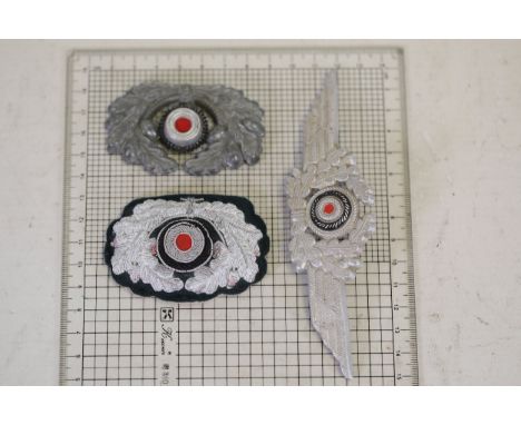WW2 German Luftwaffe Cap Insignia Collection Featuring Fabric and Metal DesignsThis collection includes significant World War