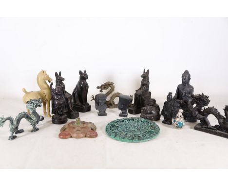 Collection of Figurines and Decorative Objects  A diverse collection of decorative sculptures and figurines, each influenced 