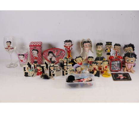 Extensive Collection of Betty Boop Ornaments and MemorabiliaThis collection comprises a wide range of Betty Boop-themed ornam