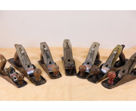 **Collection of Seven Vintage Hand Planes by Stanley and Acorn**  A curated set of seven vintage hand planes, including four 