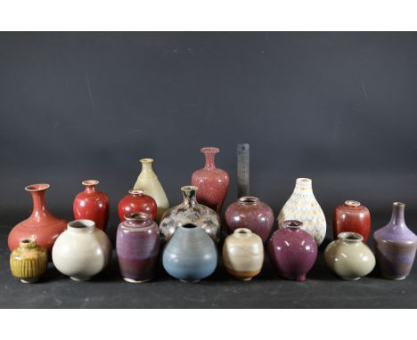 **Collection of 15 Small Ceramic Vases - Peter Vost**A curated group of 15 small hand-crafted ceramic vases, each unique in s