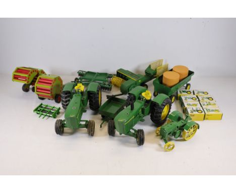 John Deere Toy Tractors and Implements Collection A diverse collection of John Deere-themed toy tractors and implements in ic