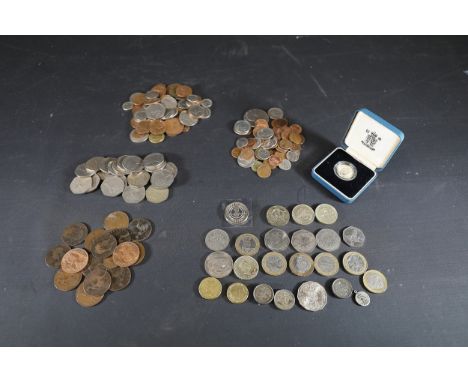 British Coin Collection, Including Commemorative Issues  The collection includes a diverse selection of British coins:  1. **