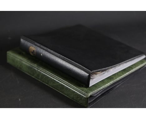 Collection of Archival Binders and Displayed CoinsA group of two archival binders, each designed for storage and display of c