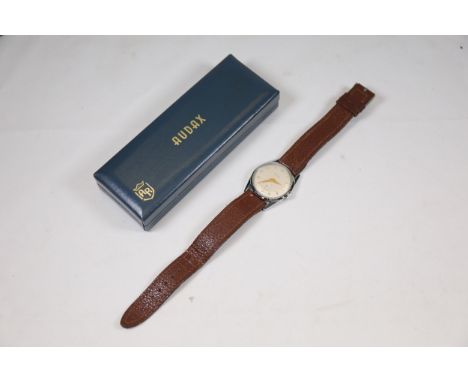 **Vintage Audax Men's Wristwatch with Original Presentation Box**  A vintage Audax men's wristwatch featuring a round dial wi