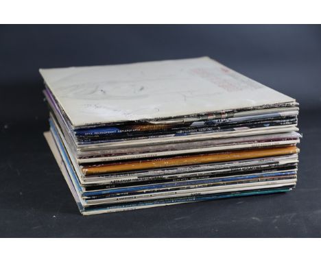 Stacked Collection of Vinyl Records  A collection of approximately thirty-five 12-inch vinyl records, sourced primarily from 