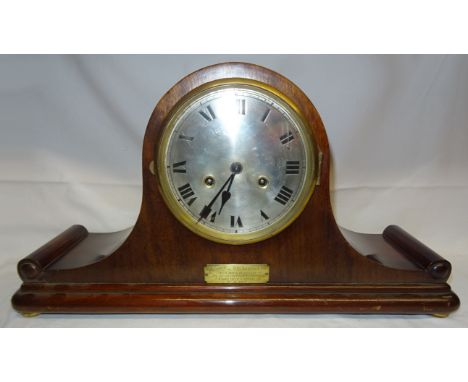 A 1920's Mantel Clock with steel dial and striking movement in mahogany case with presentation inscription.  21" (53cms) wide