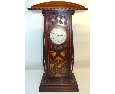 An early 20th Century Art Nouveau Mantel Clock with white dial in a floral and mother of pearl inlaid mahogany case with arch