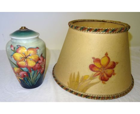 A Moorcroft Table Lamp decorated in the Freesia pattern, 6' (15cms) high, together with the original hand painted matching sh