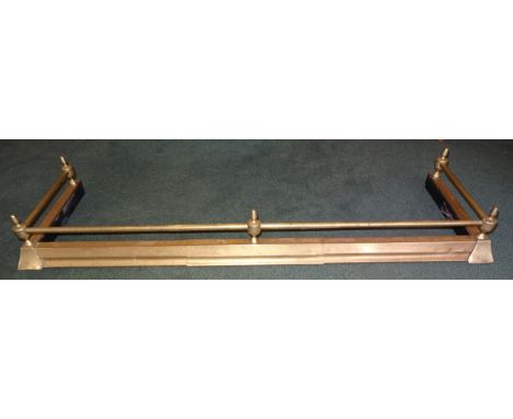 A brass Fire Curb with vase finial.  4' 4" (132cms) wide.