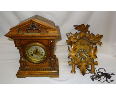 An early 19th Century Mantel Clock with German movement and gong strike in architectural style oak case. 14" (33cms) high and