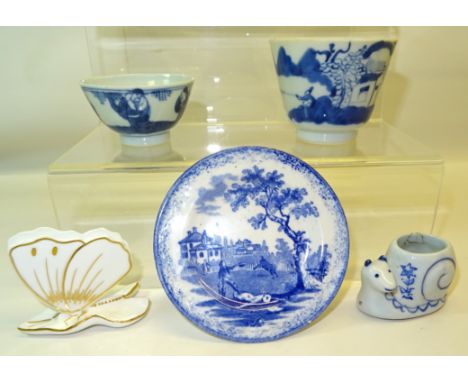 A small 19th Century blue and white Child's Plate decorated with a bull fighting scene, two Oriental pattern blue and white b