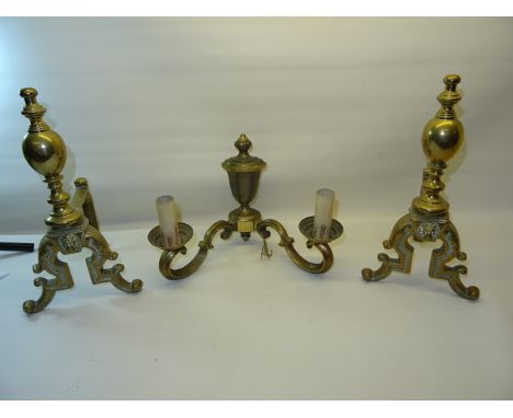 A pair of brass Implement Rests with vase finials and a brass two branch wall light. 
