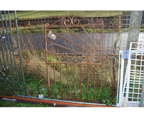 A heavy duty wrought iron gate, 31'' wide x 46'' high.