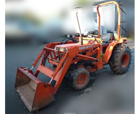 A Kubota B2150 HD serial no. 52023 diesel engined four wheel drive Compact Tractor fitted with roll-over protection frame and