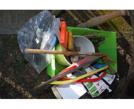 A tub of tools, bow saw, hammers, saws, rake, chimney sweep brush head, etc.