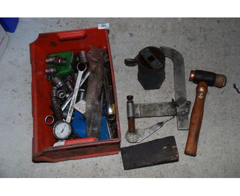 An assortment of sockets, spanners, hydraulic oil pressure gauge, box spanner and valve clamp.