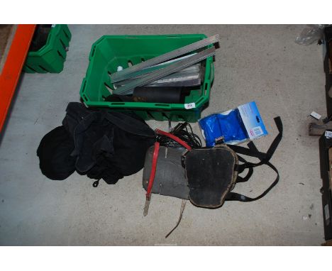 A 12 volt inspection lamp, masks, knee pads, rubber belting and aluminium striping.