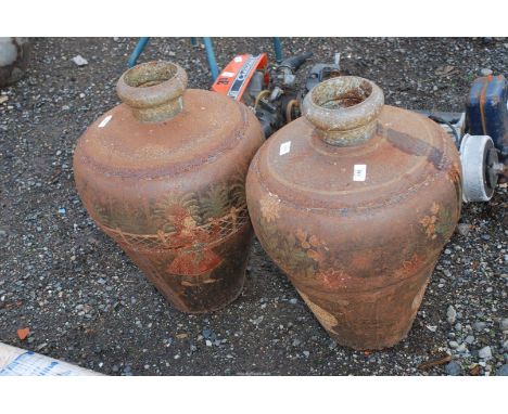 Two light metal urns with painted decoration.