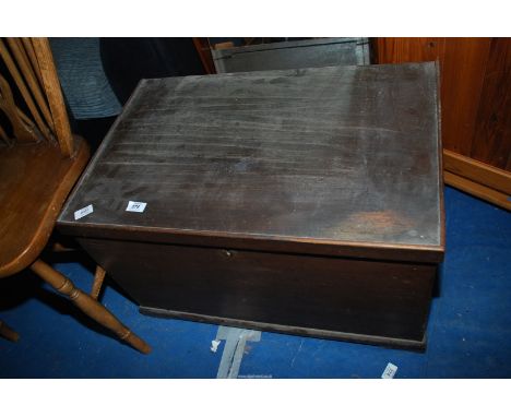 A dark wood chest with candle box and vintage suitcase, 28" wide x 18" deep x 17" high.