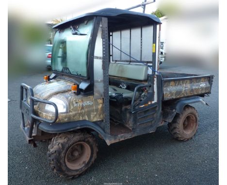A Kubota RTV 900 diesel-engined 4 x 4 rugged terrain vehicle with cab and power steering and finished in camouflage colours. 