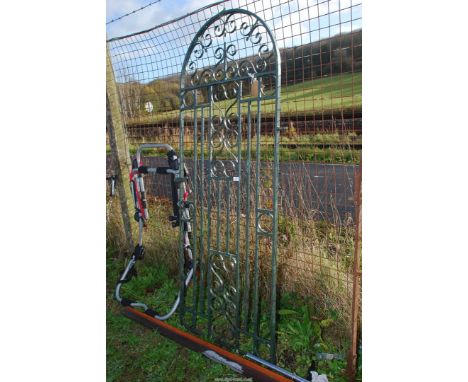 A wrought iron Gate with arched top, 28'' wide x 6' high.