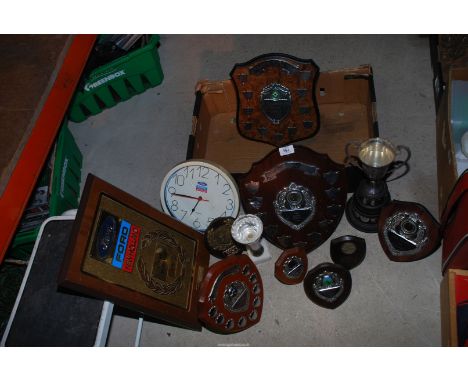 A Ford clock and a quantity of shields.